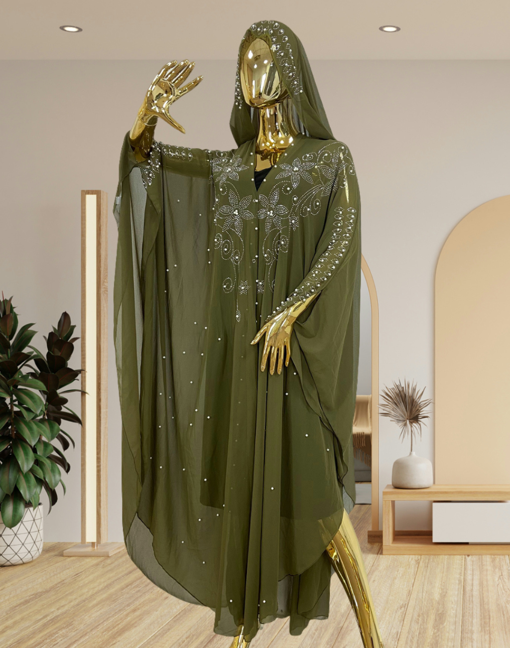 正面に立つマネキンが、ビジューが煌めくピスタチオのガラベーヤをまとった全身カット。ベリーダンス衣装の上に重ねてもラインが崩れにくく、控室で落ち着いて準備するシーンが想像できる構図。